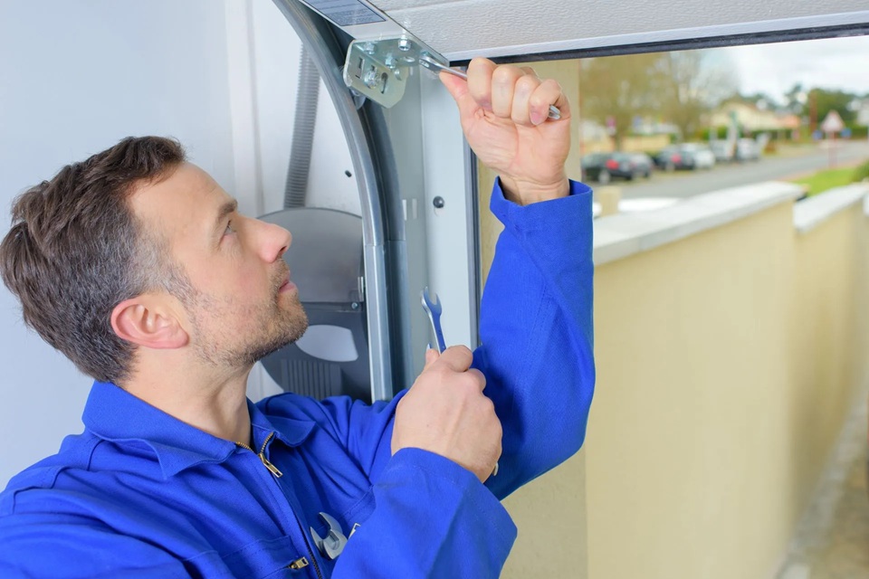Homeowner Call A Garage Door Repairman